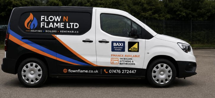 The side of the Flow N Flame van in black and white with orange and blue livery, listing heating, boilers and renewables